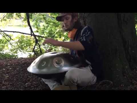 Emanuel is playing a amzing sounding Magical Handpan in a Park of Münster.